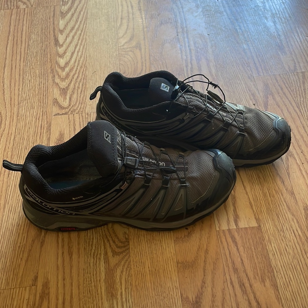 Gray and Black Salomon trail running shoes